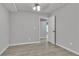 Bedroom featuring a ceiling fan and wood-look flooring at 818 Prada Ct, Lawrenceville, GA 30043