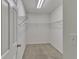 Walk-in closet featuring carpet flooring and white wire shelving for storage at 818 Prada Ct, Lawrenceville, GA 30043