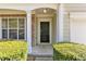 Inviting front door entrance with brick accents and manicured bushes at 818 Prada Ct, Lawrenceville, GA 30043