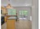 Bright kitchen featuring wooden cabinets, an island, and sliding glass doors to a wooden deck at 818 Prada Ct, Lawrenceville, GA 30043