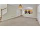 Inviting living room with plush carpeting, view of the kitchen, and modern decor at 818 Prada Ct, Lawrenceville, GA 30043