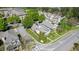 A neighborhood is captured from an aerial perspective, featuring landscaped townhomes and lush trees at 121 Dunleith Sw Pkwy, Marietta, GA 30008