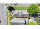 Birds-eye view displays townhome rooftops, nearby greenery, and adjacent roadways and parking areas at 121 Dunleith Sw Pkwy, Marietta, GA 30008