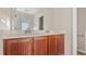 Bathroom vanity with double sinks and a large mirror, offering ample counter space at 121 Dunleith Sw Pkwy, Marietta, GA 30008