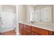 Bathroom with vanity adjacent to a full tub and shower at 121 Dunleith Sw Pkwy, Marietta, GA 30008