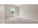 Bright bedroom featuring plush carpet and a window that brings in natural light at 121 Dunleith Sw Pkwy, Marietta, GA 30008