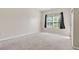 Bedroom featuring a window with dark curtains and plush carpet at 121 Dunleith Sw Pkwy, Marietta, GA 30008