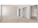 Bright bedroom features neutral walls, plush carpeting, and open closet with white doors at 121 Dunleith Sw Pkwy, Marietta, GA 30008