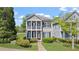 Charming two-story home with a welcoming front porch and well-manicured landscaping at 121 Dunleith Sw Pkwy, Marietta, GA 30008