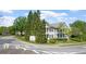 View of a residential neighborhood with two-story homes and lush greenery at 121 Dunleith Sw Pkwy, Marietta, GA 30008
