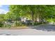 Neighborhood street with a community mailbox and lush green trees lining the street at 121 Dunleith Sw Pkwy, Marietta, GA 30008