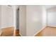 Hallway with hardwood floors leading to various rooms in the home at 121 Dunleith Sw Pkwy, Marietta, GA 30008