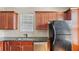 Kitchen featuring dark cabinets, granite countertops, and stainless steel appliances at 121 Dunleith Sw Pkwy, Marietta, GA 30008
