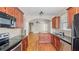Open kitchen with granite countertops, stainless steel appliances and hardwood floors at 121 Dunleith Sw Pkwy, Marietta, GA 30008