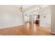 Open-concept living space with hardwood floors and arched doorways leading to other rooms at 121 Dunleith Sw Pkwy, Marietta, GA 30008
