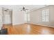 Bright, open living room with hardwood floors, large windows, and a ceiling fan at 121 Dunleith Sw Pkwy, Marietta, GA 30008