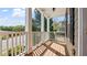 Covered front porch with white pillars and a wooden deck at 121 Dunleith Sw Pkwy, Marietta, GA 30008