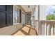 Inviting covered porch with black shutters and natural lighting at 121 Dunleith Sw Pkwy, Marietta, GA 30008