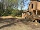 A mulched backyard area leading to a home with a deck and wooded surroundings at 2915 Creek Park Dr, Marietta, GA 30062