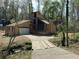 Beautiful exterior view of a multi-story home with a driveway over a creek at 2915 Creek Park Dr, Marietta, GA 30062
