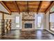 Spacious living room with stone fireplace, wood floors, and natural wood accents at 2915 Creek Park Dr, Marietta, GA 30062