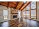 Living room with a stone fireplace, wood floors, and vaulted wood ceilings at 2915 Creek Park Dr, Marietta, GA 30062