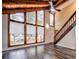 Living room featuring vaulted ceilings, many windows for natural light and wood staircase at 2915 Creek Park Dr, Marietta, GA 30062