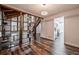 Open concept living room showcasing wood floors, built-in shelving and access to modern kitchen at 2915 Creek Park Dr, Marietta, GA 30062