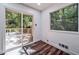 A light-filled living space with hardwood floors and access to the outdoor deck at 2915 Creek Park Dr, Marietta, GA 30062