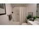 Bathroom featuring shower-tub combo, vanity with sink, and modern decor at 63 Fair Haven Se Way, Smyrna, GA 30080
