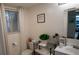 Cozy bathroom with toilet, white vanity and shelving for towels and decor at 63 Fair Haven Se Way, Smyrna, GA 30080