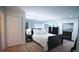 Comfortable bedroom with mirrored wall, a cozy fireplace, and dark wood furniture at 63 Fair Haven Se Way, Smyrna, GA 30080