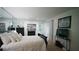 Bedroom with a mirrored wall and comfortable decor featuring hardwood floors at 63 Fair Haven Se Way, Smyrna, GA 30080