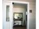 Front door entryway with decorated table with a framed mirror and decor accents at 63 Fair Haven Se Way, Smyrna, GA 30080