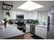Updated kitchen featuring stainless steel appliances, white cabinets, and light countertops at 63 Fair Haven Se Way, Smyrna, GA 30080
