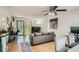 Bright living room featuring a comfortable sofa, large TV, and sliding glass doors at 63 Fair Haven Se Way, Smyrna, GA 30080