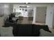 Living room with open concept to the kitchen featuring a neutral color palette and hardwood floors at 63 Fair Haven Se Way, Smyrna, GA 30080