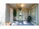 Relaxing outdoor patio space featuring chairs, a table, a grill, and plants at 63 Fair Haven Se Way, Smyrna, GA 30080