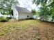 A spacious backyard with mature trees and full privacy fencing at 645 Crossbridge Aly, Johns Creek, GA 30022