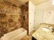 Bathroom featuring granite counters, tiled shower and tiled floors at 645 Crossbridge Aly, Johns Creek, GA 30022
