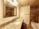 Modern bathroom with granite counters, tiled shower, and elegant fixtures at 645 Crossbridge Aly, Johns Creek, GA 30022