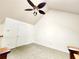 Neutral bedroom space with vaulted ceilings and fan at 645 Crossbridge Aly, Johns Creek, GA 30022