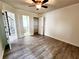 Spacious bedroom with hardwood floors and ample closet space at 645 Crossbridge Aly, Johns Creek, GA 30022