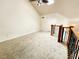 Neutral bedroom space with vaulted ceilings and fan at 645 Crossbridge Aly, Johns Creek, GA 30022