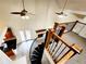 Lofted view showcasing the spiral staircase and fireplace of the living room at 645 Crossbridge Aly, Johns Creek, GA 30022