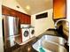 Well-equipped kitchen with stainless steel refrigerator and granite countertops at 645 Crossbridge Aly, Johns Creek, GA 30022