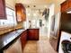 Modern kitchen with stainless steel appliances, granite countertops and open view at 645 Crossbridge Aly, Johns Creek, GA 30022