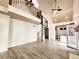 Open-concept living area with spiral staircase, and modern finishes at 645 Crossbridge Aly, Johns Creek, GA 30022