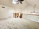 Bright living room boasts vaulted ceilings, skylights and fans, plus decorative railing at 645 Crossbridge Aly, Johns Creek, GA 30022