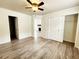 Bright main bedroom featuring wood floors, ensuite access, and closet at 645 Crossbridge Aly, Johns Creek, GA 30022